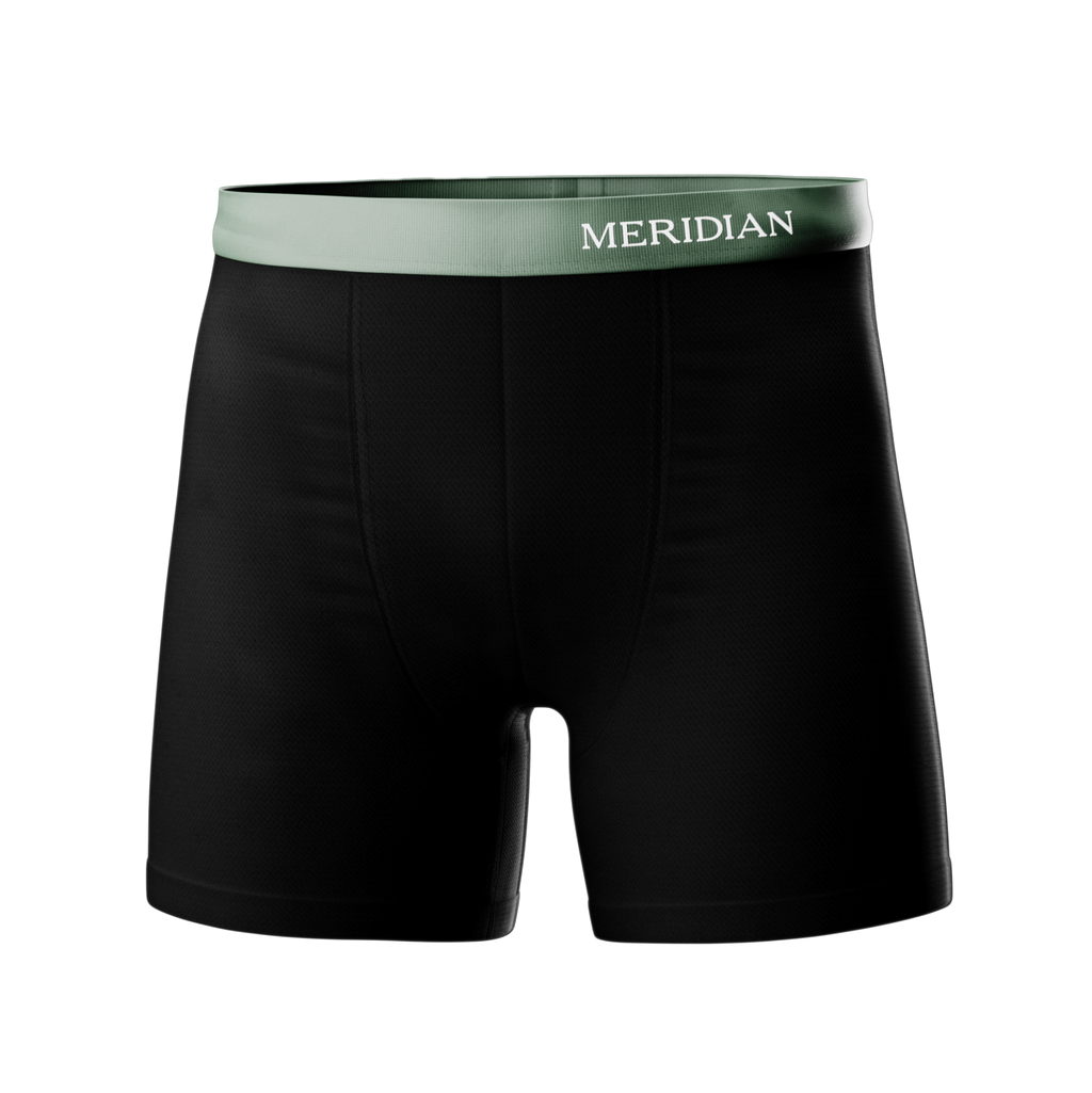 Black boxer briefs with a green waistband featuring the Meridian brand name.